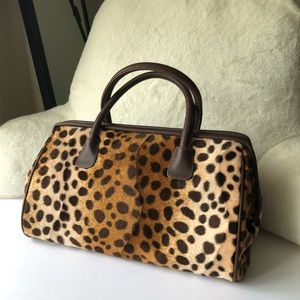 LANCÔME cheetah print furry travel bag